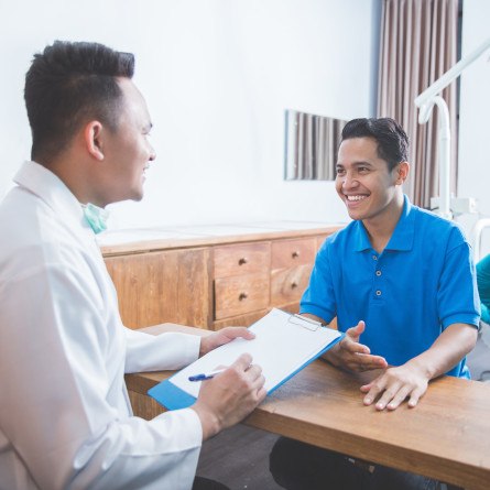 patient talking to dentist about financing options